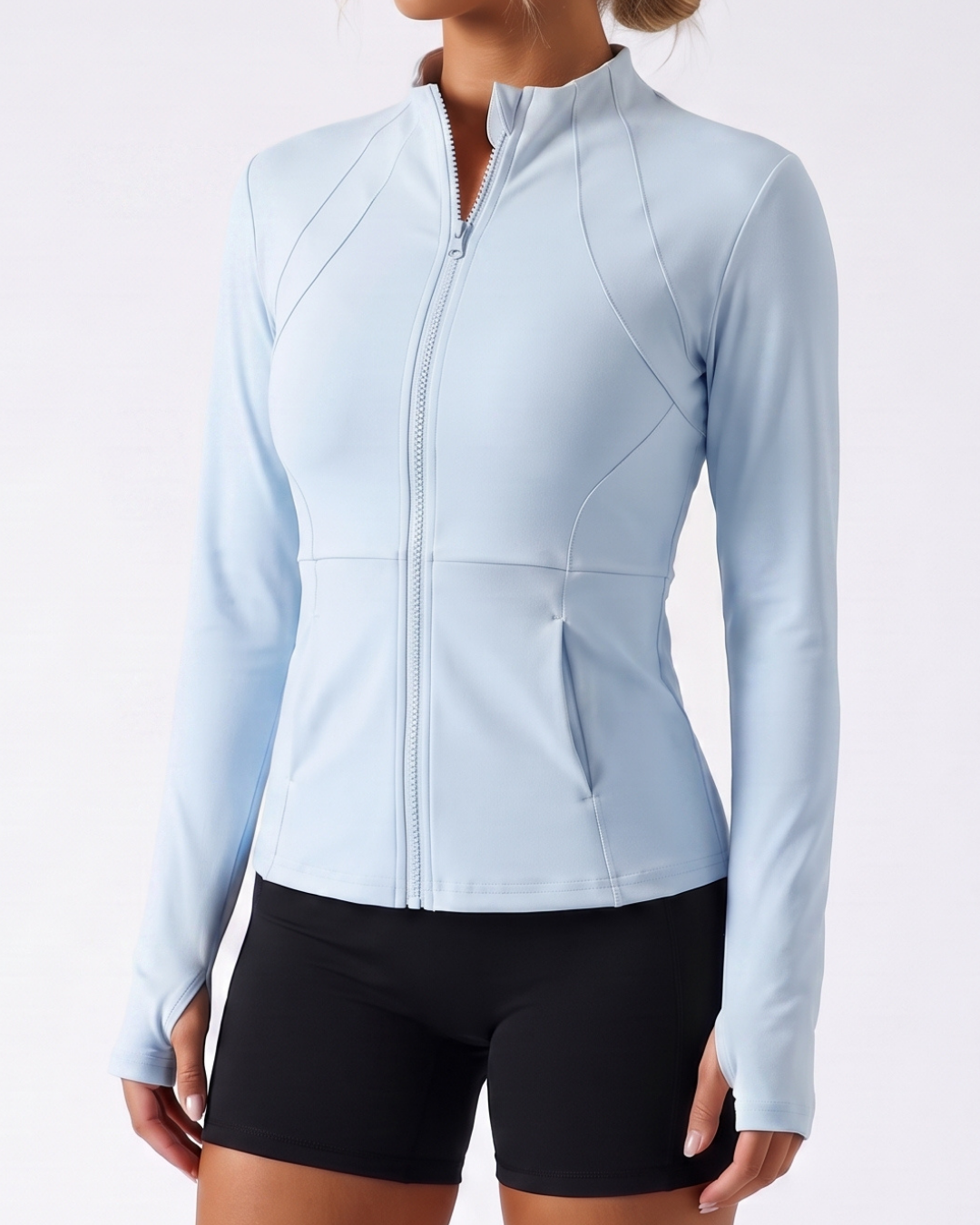 Cadence Fitted Training Jacket in Light Blue, contour seams and zip pockets #Color_Light Blue